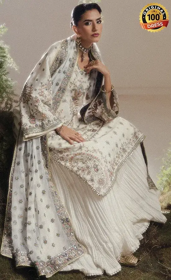 Pakistani white sharara suit for wedding guests with embroidered silk, organza and chiffon detailing