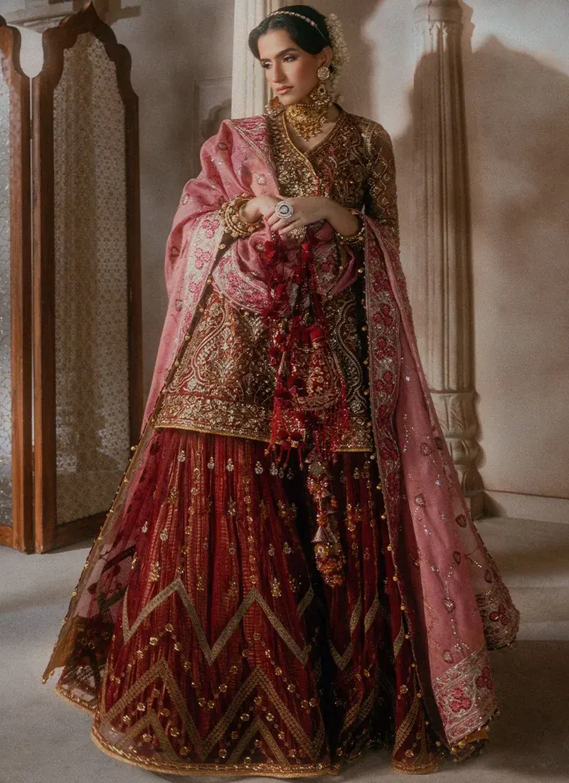 Dark green medium silk salwar kameez with an embellished front and embroidered neckline