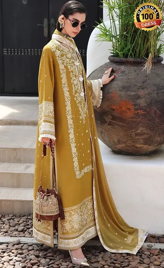 Pakistani mustard yellow salwar kameez for wedding guests with intricate embroidery and graceful formal styling