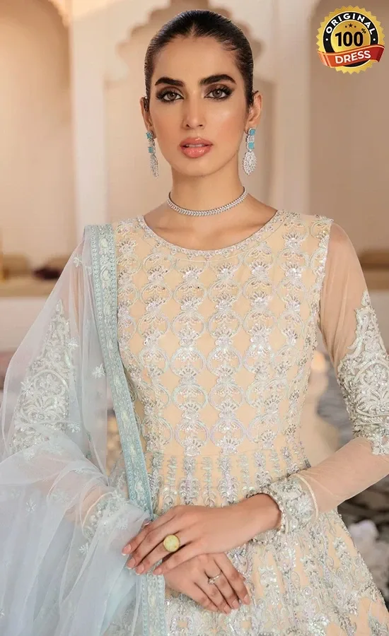 Pakistani blue Anarkali dress for wedding guests with elegant embroidery and graceful floor-length styling