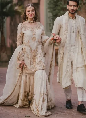 White bridal gharara for Nikah ceremony with intricate hand embroidery and graceful Eastern bridal design