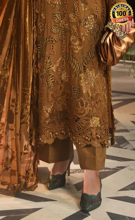 Pakistani golden salwar suit for wedding guests with detailed hand embroidery and graceful finishing