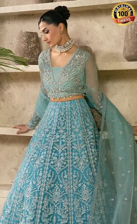 Teal lehenga for wedding guests with elegant hand embroidery and organza detailing