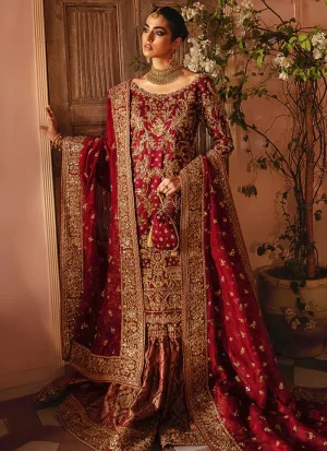 Full-length front view of the maroon bridal gharara with dense metallic Zardozi on the Tissue Silk kameez, Jamawar flare and bordered Chiffon dupatta.