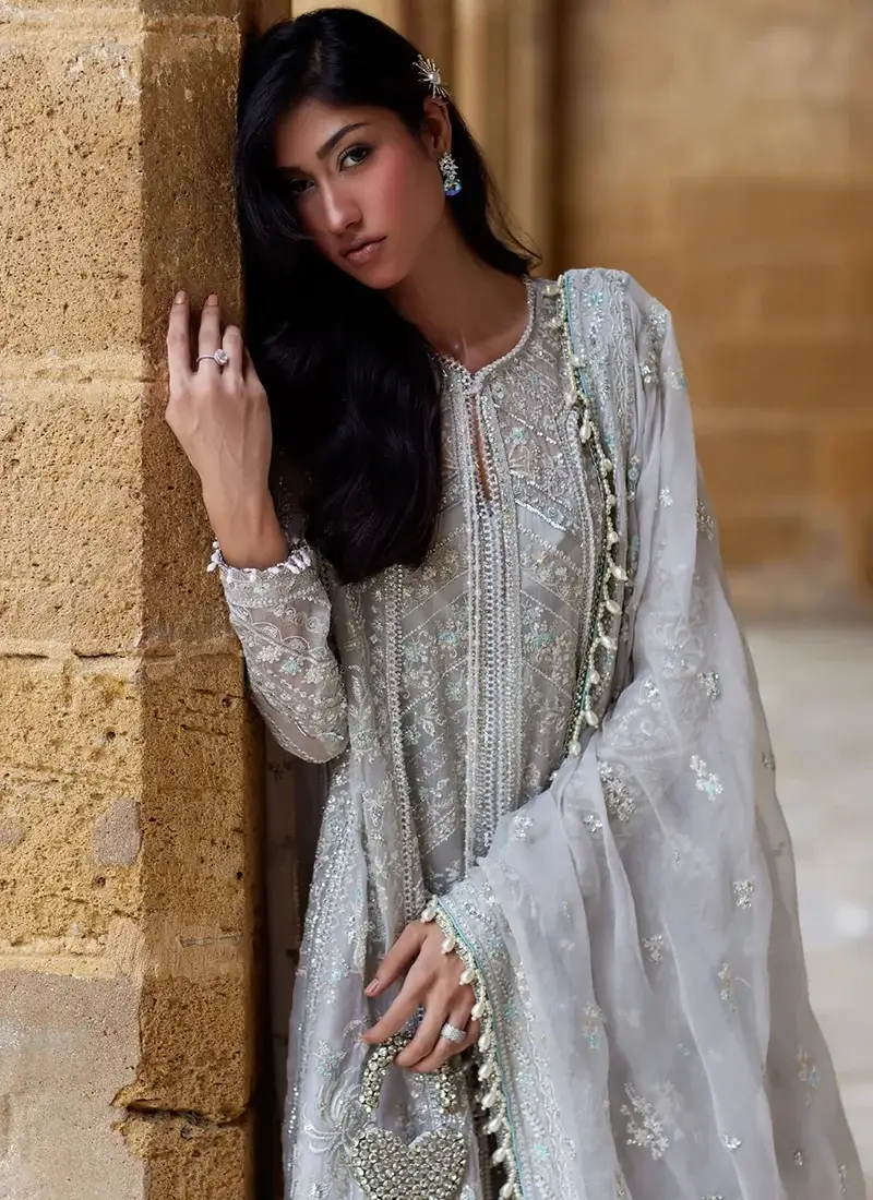 Light blue salwar kameez featuring crystal tassels, embroidery and sequin work