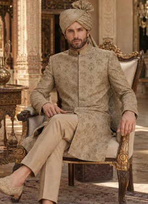 Beige embroidered sherwani for groom with matching trousers, turban and traditional khussa