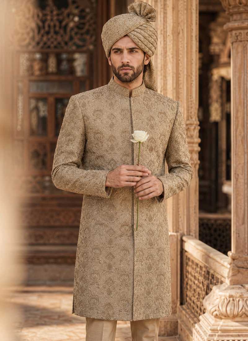 Groom wearing beige embroidered wedding sherwani with matching turban