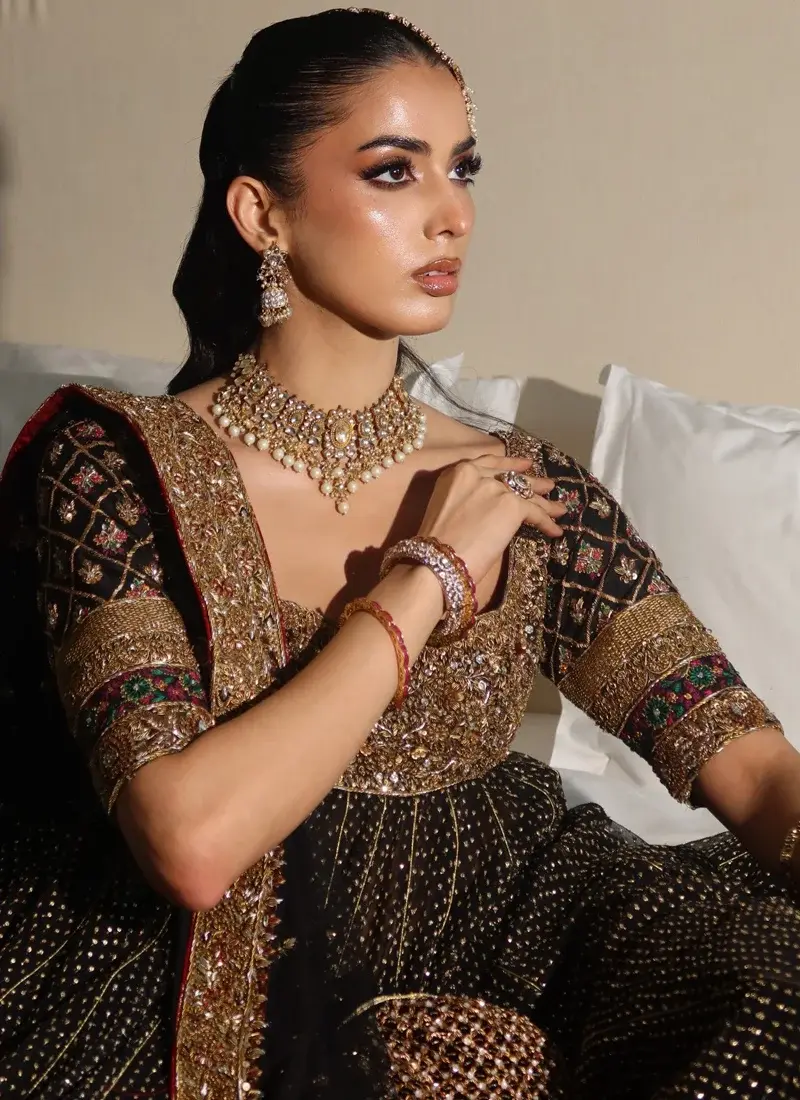 Black and gold Pakistani bridal Kalidar Pishwas with embellished bodice and multicolour sleeves