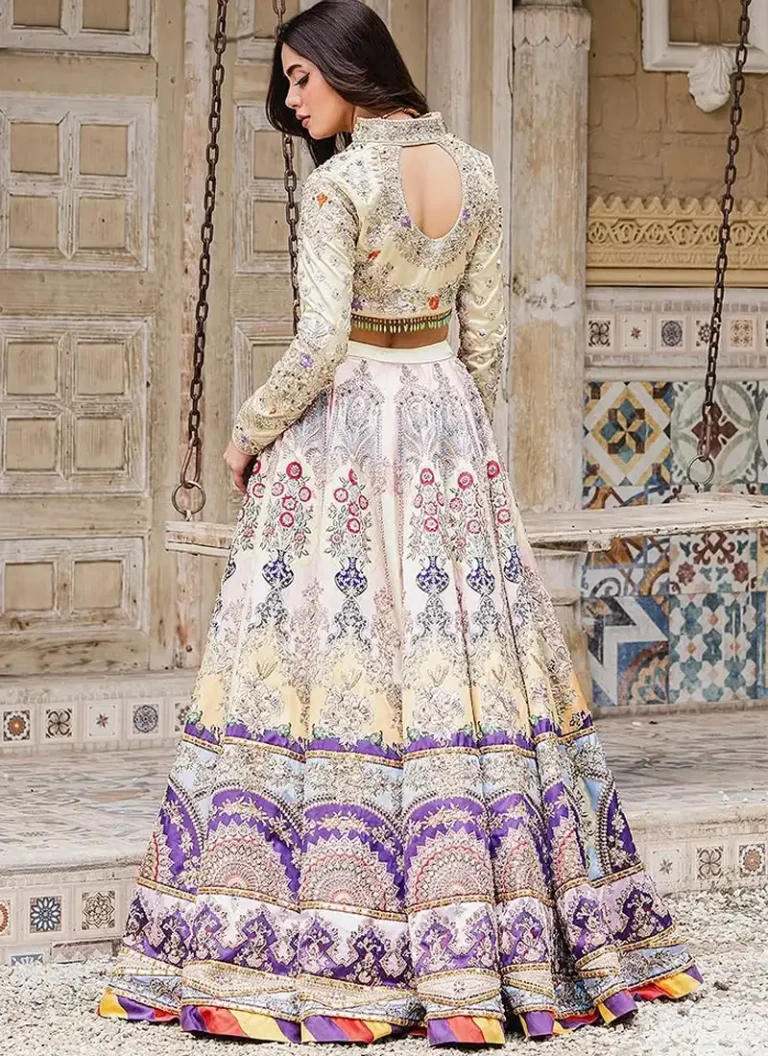 Ahmed Sultan-inspired cream bridal lehenga with silver embroidery and purple and multicoloured bands at the hem.