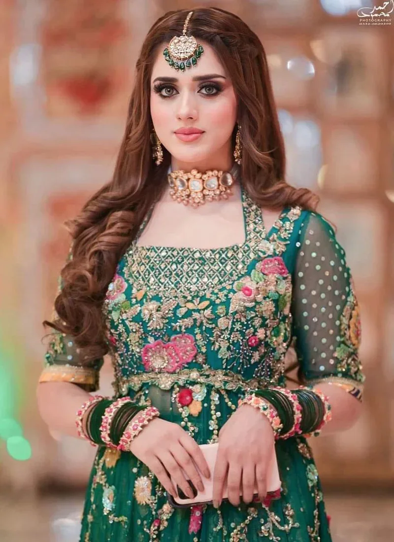 Emerald green floral bridal Pishwas with lehenga and elegant crystal embellishments