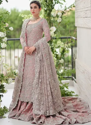 Baby-pink Farshi lehenga with silver work, ankle-length tissue silk shirt and a scalloped net dupatta.
