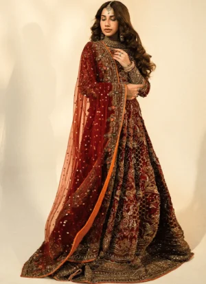 Maroon and orange lehenga choli in tissue silk with antique-gold, bronze and copper embroidery and a chiffon dupatta.