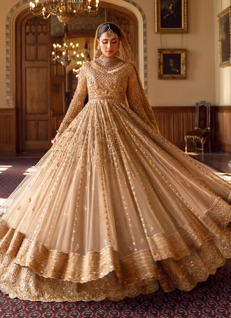Hand Embellished Golden Net Pishwas Hand embellished golden net pishwas with intricate bridal embroidery and elegant detailing