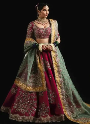 Hot-pink Hussain Rehar-inspired bridal lehenga choli in tissue silk with gold, silver and rose-gold embroidery and a yellow organza dupatta.