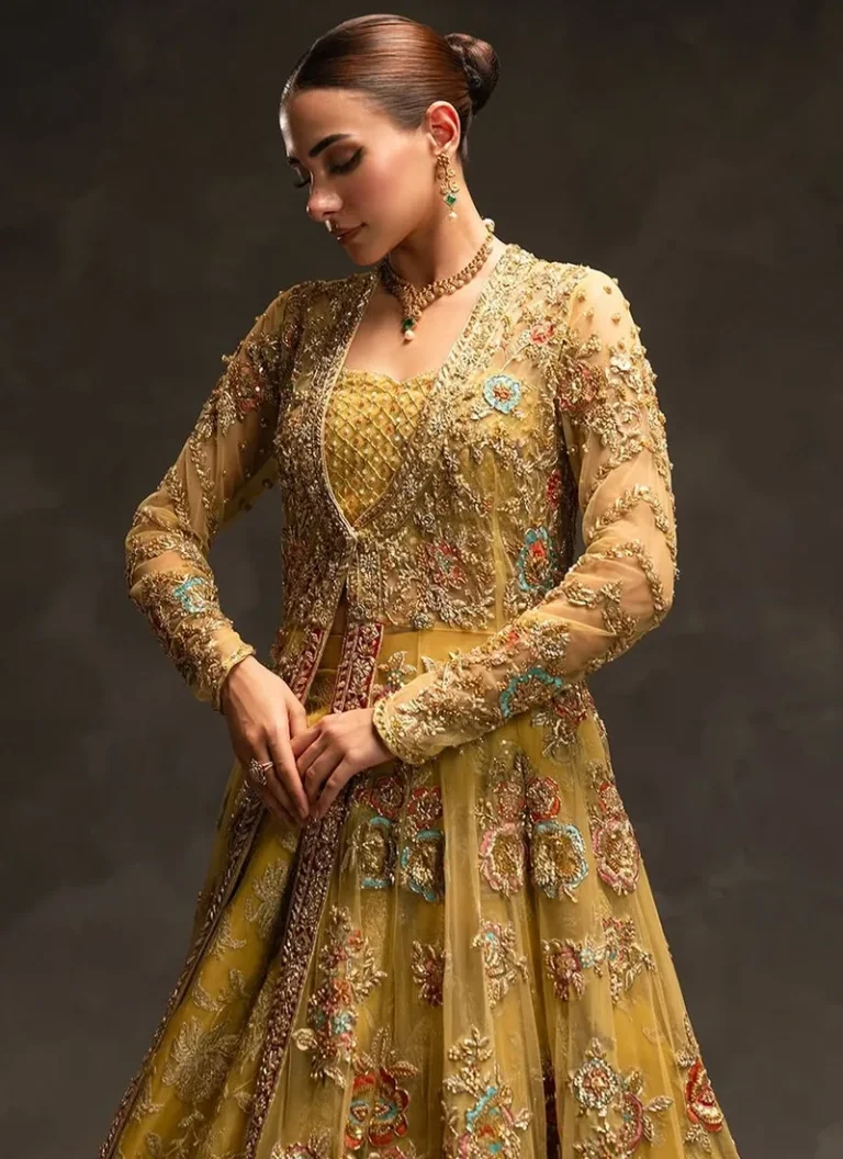 Mustard bridal peshwas with gold-toned and multicoloured embroidery, full sleeves and scoop neckline.