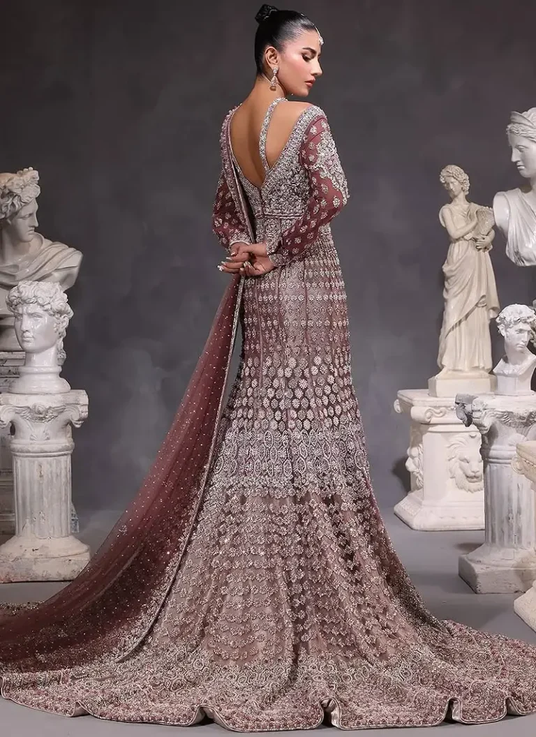 Plum bridal gown with antique-silver, rose-gold and tonal embroidery, high neck and full sleeves.
