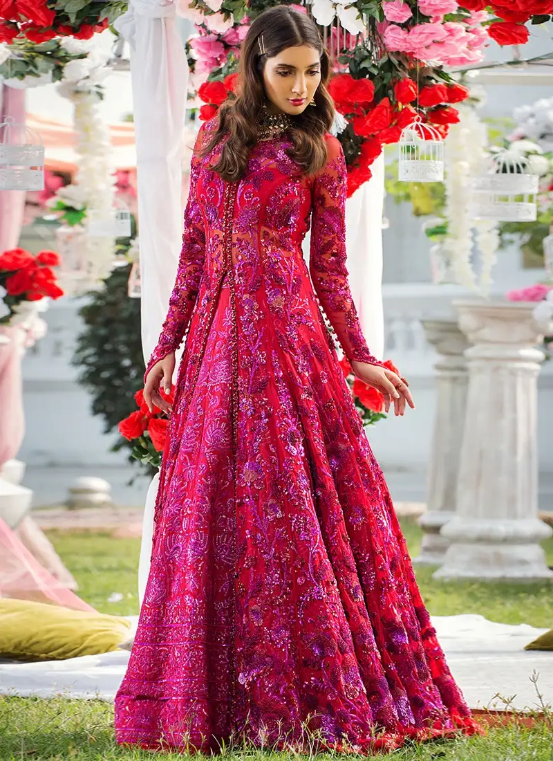 Red two-piece bridal gown with full sleeves, closed back and flared floor-length open-gown silhouette
