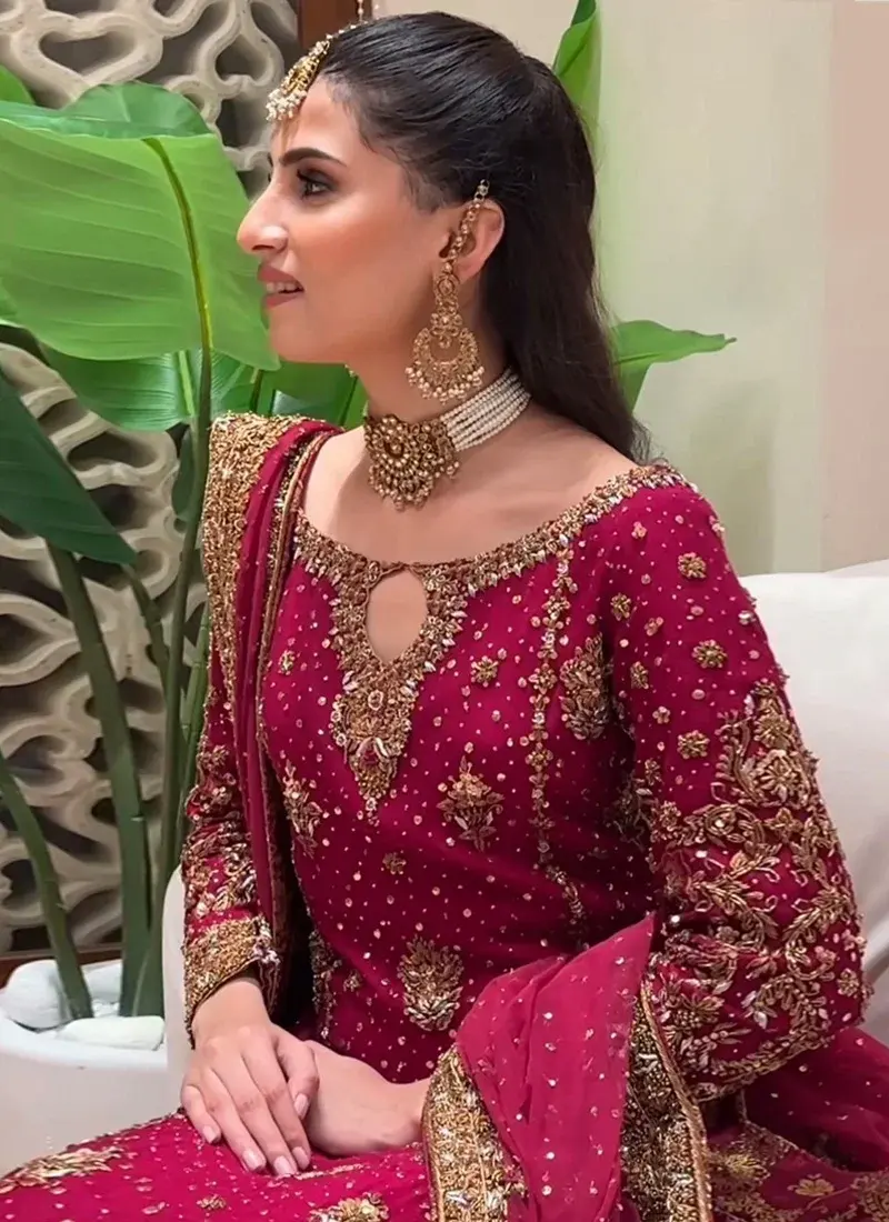 Ruby Red Formal Dress with Gold Zardozi Embroidery Ruby red zardozi long formal dress in chiffon with gold embroidery, Katan silk trousers and a matching chiffon dupatta