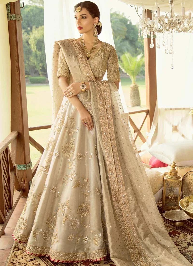 Silver-gold bridal lehenga choli with gold, silver, copper and rose-gold embroidery and a 3.5-yard organza dupatta