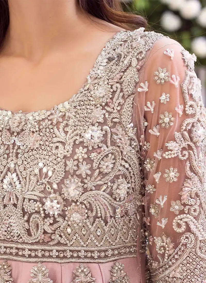 Baby pink bridal lehenga set with silver floral embroidery, round neckline and fringed net peshwas over silk