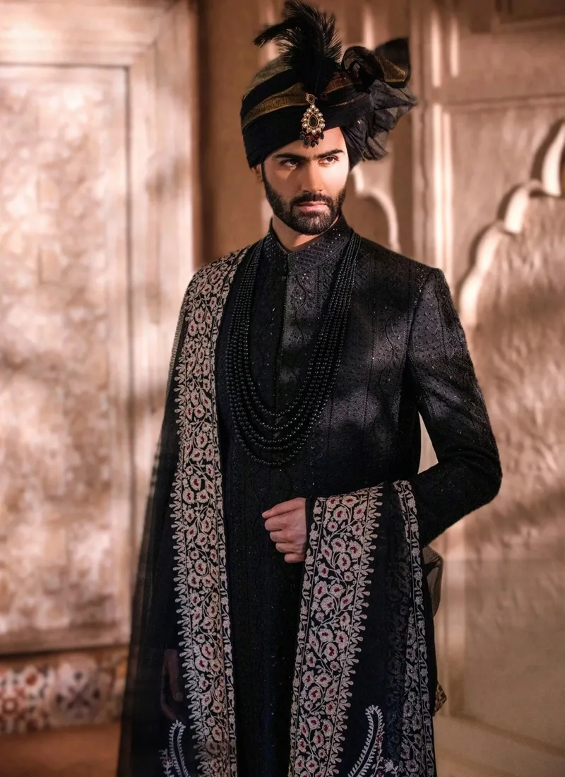 Traditional black wedding sherwani with coordinated black shawl and turban for groom wear