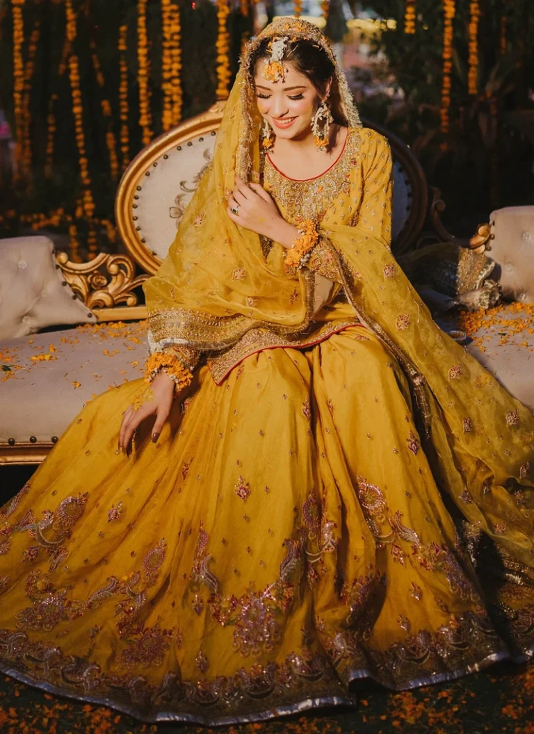 Yellow Mehndi Dress for Bride Yellow Mehndi dress for bride with heavy hand embellishment and traditional bridal detailing