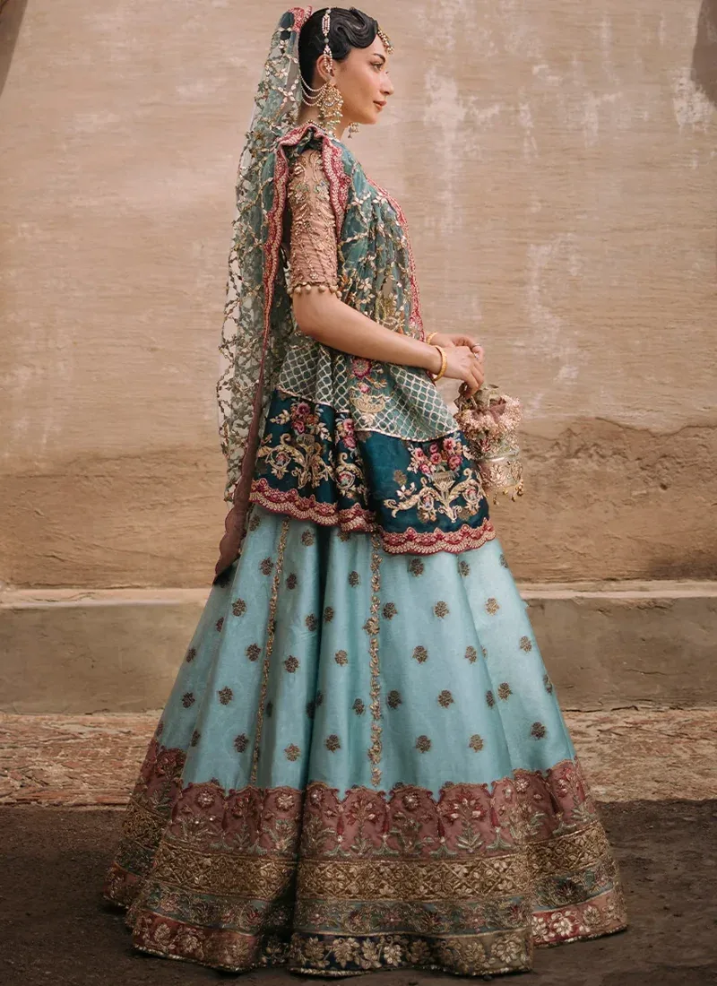 Aqua mehndi lehenga choli in a swirling front view with a blush embroidered blouse and dark teal floral dupatta