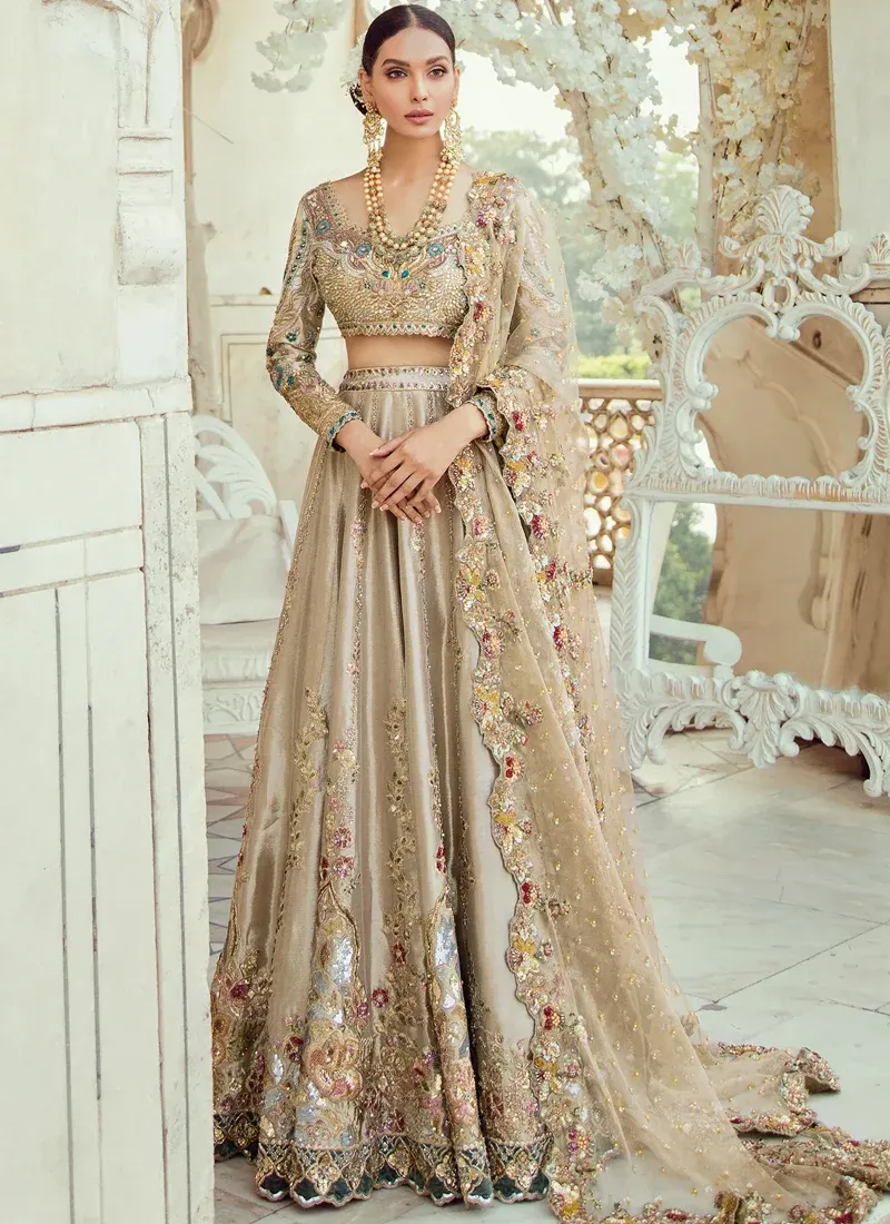 Champagne Walima lehenga choli full front view with wide embroidered skirt, scalloped teal hem and floral dupatta