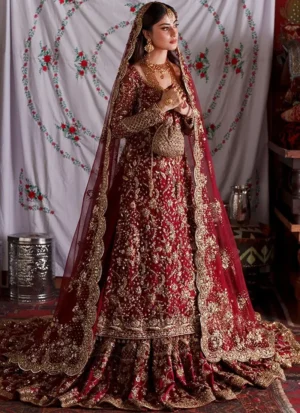 Deep red farshi lehenga side view with gold floral embroidery and scalloped net dupatta border