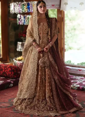 Front view of the gold lehenga choli with a rust-gold blouse, champagne veil on one side, wine dupatta on the other and a scalloped floral hem