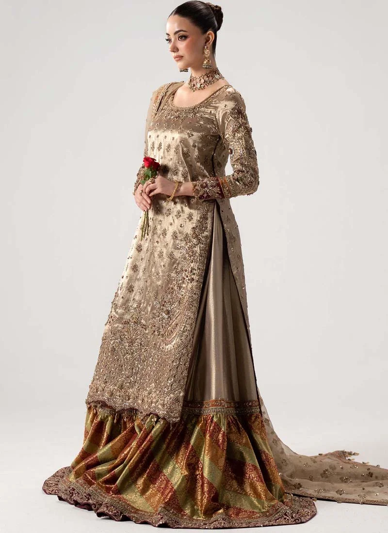 Antique gold gharara suit bodice close-up with scoop neckline, raised floral sleeve embroidery and maroon cuffs