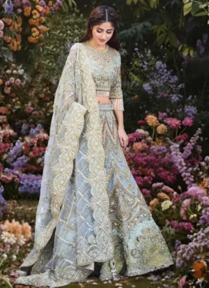 Ice blue bridal lehenga choli full-length front view with ornate paisley panels and sheer floral dupatta