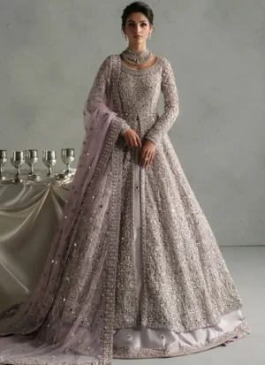 Dusty lilac bridal gown, back three-quarter view with dense silver embroidery and sheer bordered dupatta