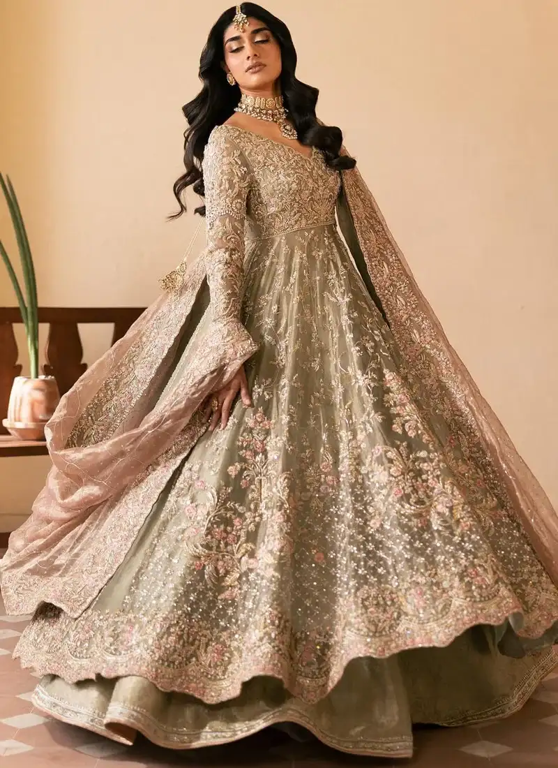 Olive bridal pishwas in sweeping front view with scalloped floral hem and sheer tea-pink dupatta