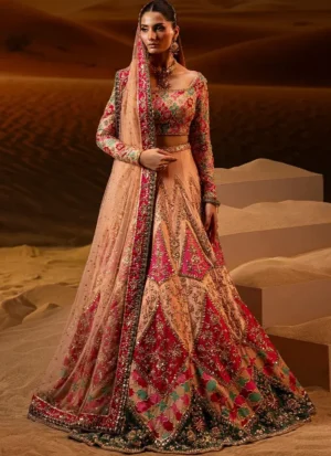 Peach and hot pink bridal lehenga choli front detail with gold floral embroidery and a wide scoop neckline