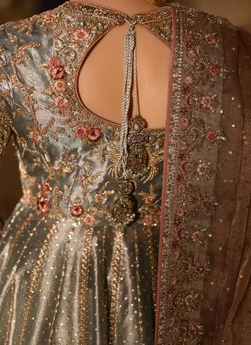 Sage green bridal peshwas bodice close-up with sweetheart neckline and pink floral embroidery