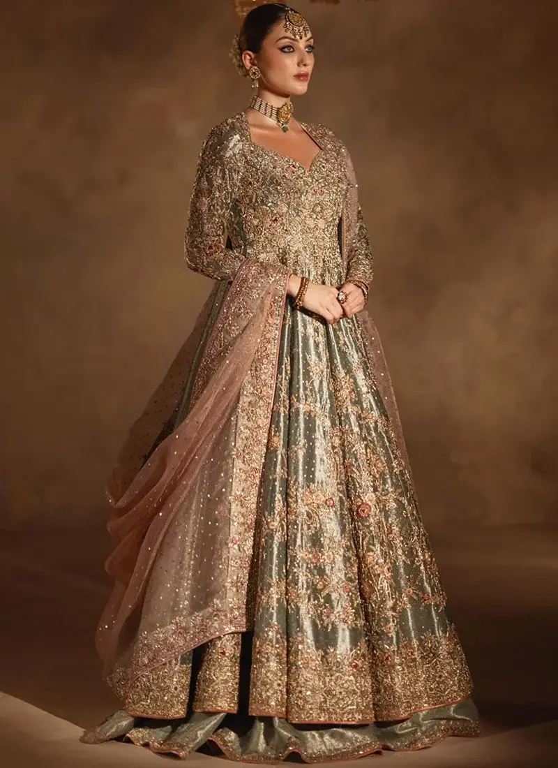 Sage green bridal peshwas back close-up with keyhole cut-out and jewelled tassel ties