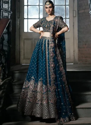 Zinc blue bridal lehenga choli side view with vertical embroidered panels and ornate floral paisley motifs